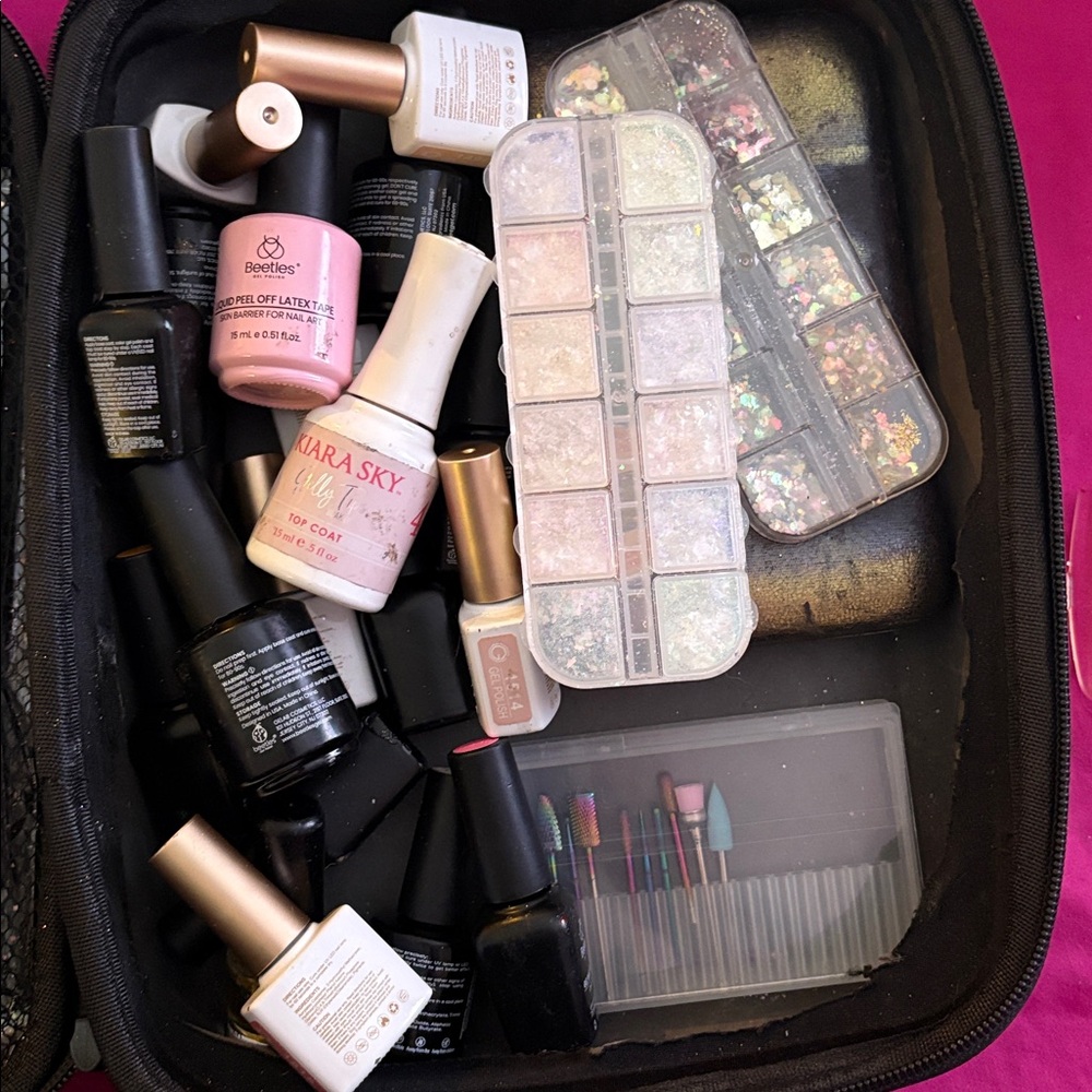 Assorted gel nail polishes, nail tips, nail accessories